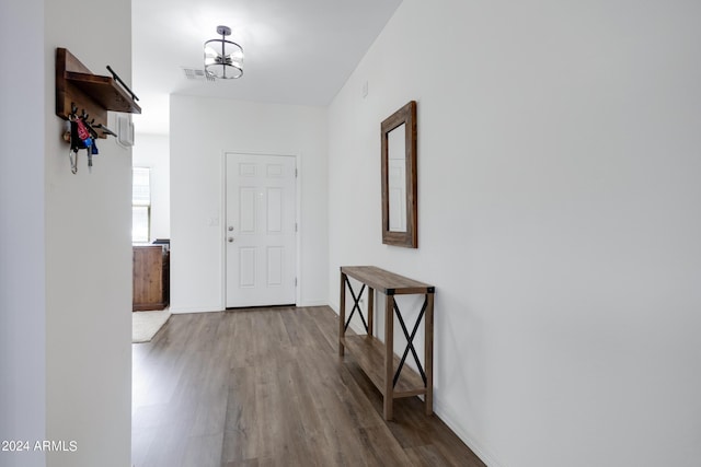 interior space with hardwood / wood-style flooring and a notable chandelier