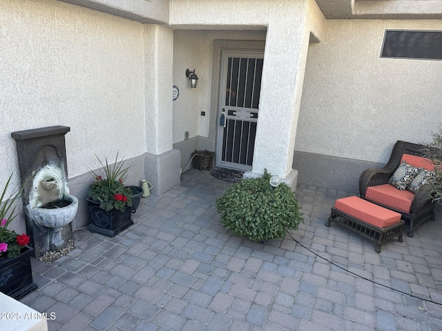 doorway to property with a patio