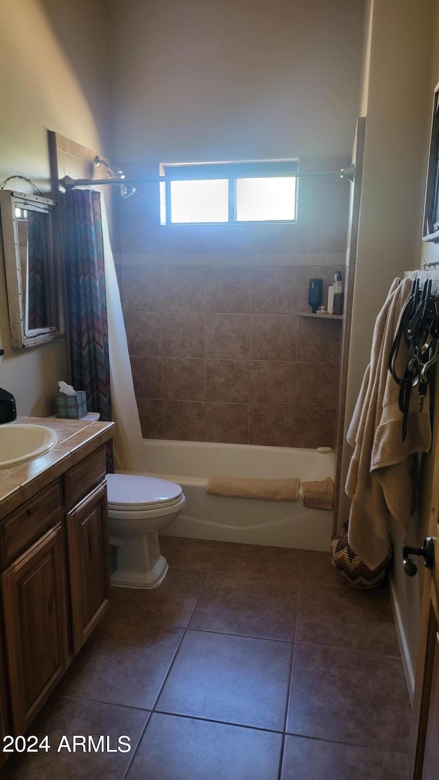 full bathroom with vanity, toilet, tile patterned floors, and shower / bathtub combination with curtain