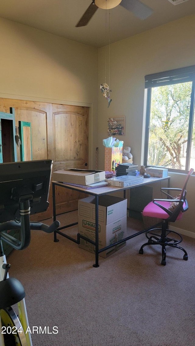 office featuring carpet floors and ceiling fan