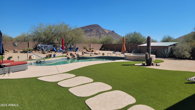 view of yard with a fenced in pool, a patio area, and a mountain view