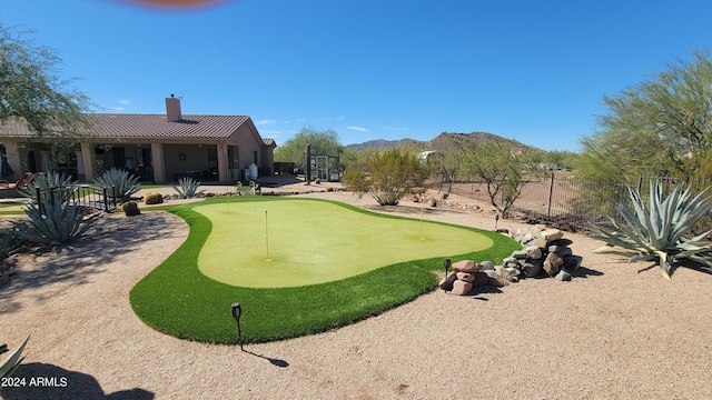 surrounding community featuring a patio and a mountain view