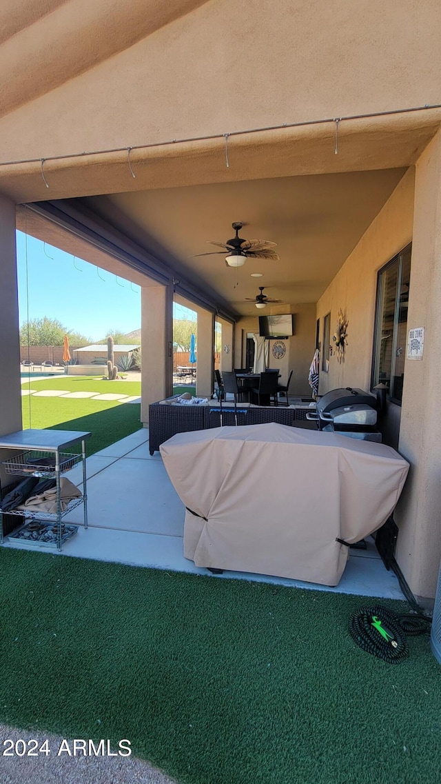 view of patio featuring ceiling fan