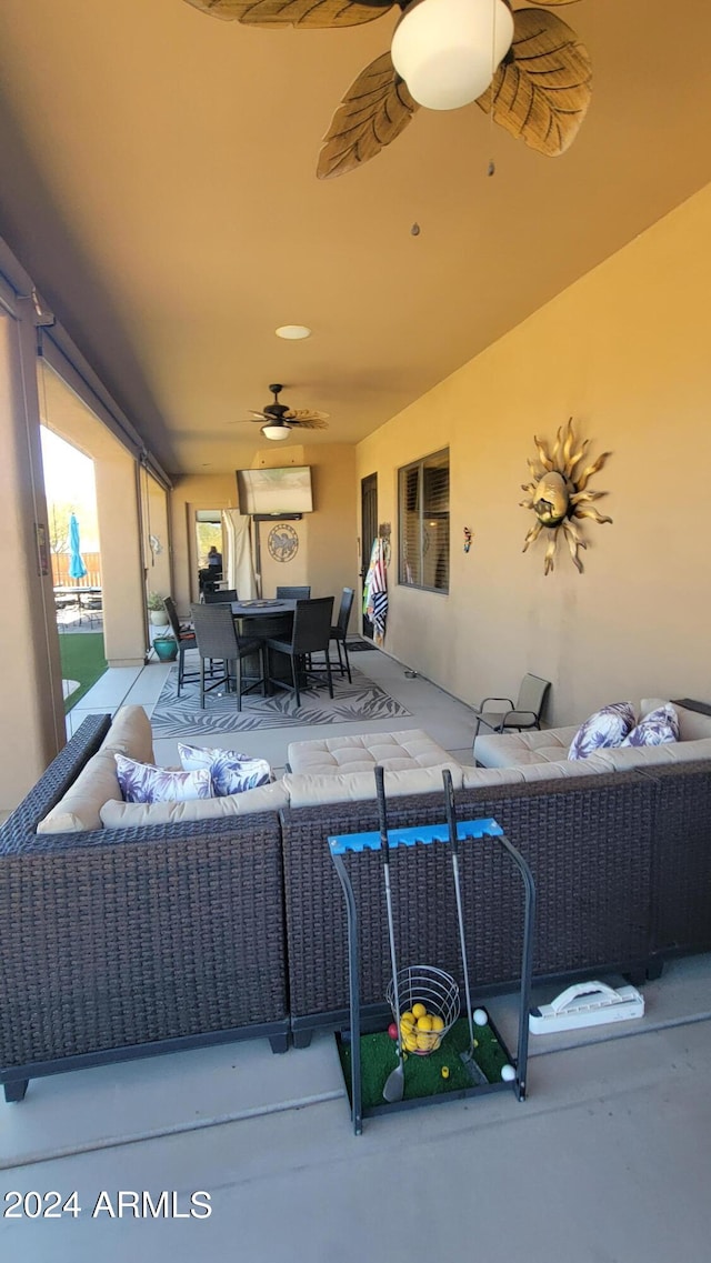 view of patio featuring ceiling fan