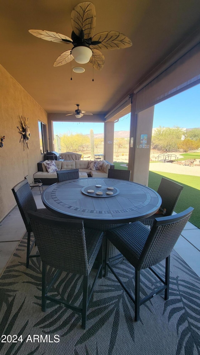 view of patio featuring ceiling fan