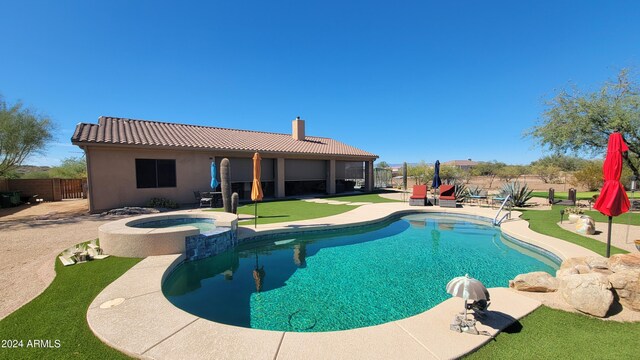 view of swimming pool featuring an in ground hot tub and a patio