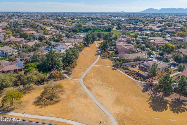 birds eye view of property featuring a mountain view