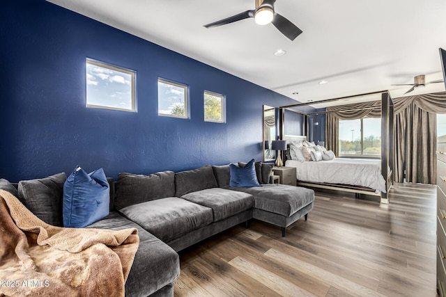 bedroom with hardwood / wood-style floors and ceiling fan