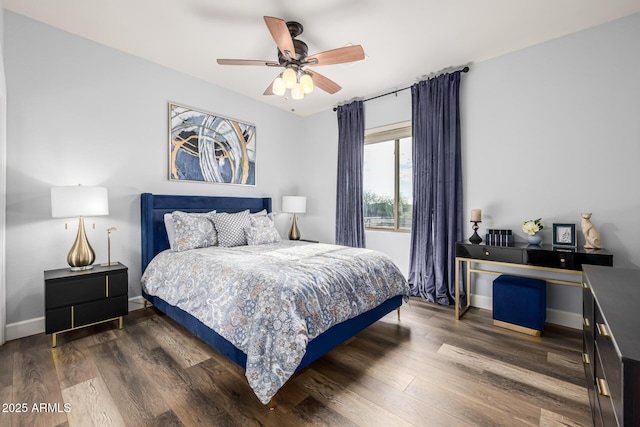 bedroom with dark wood-type flooring and ceiling fan