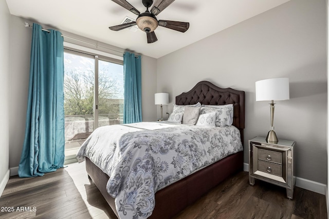 bedroom featuring dark hardwood / wood-style floors, access to exterior, and ceiling fan