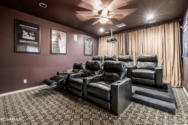 carpeted cinema featuring ceiling fan