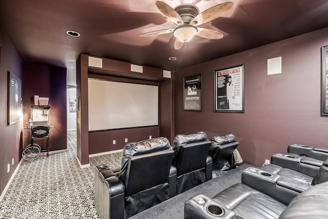 home theater featuring light colored carpet and ceiling fan