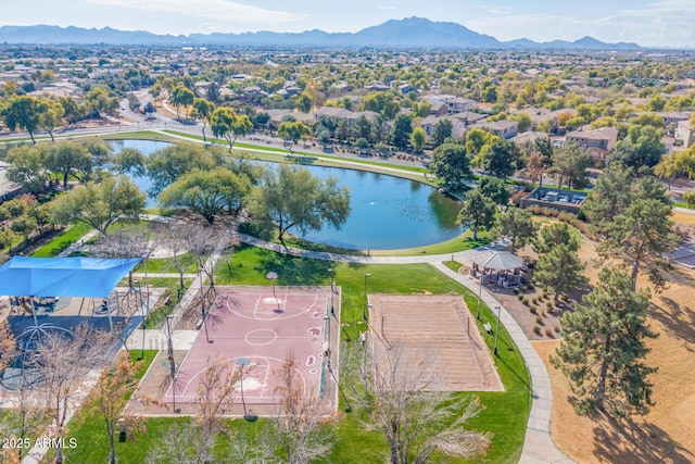 drone / aerial view featuring a water and mountain view