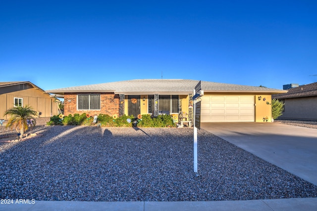 single story home featuring a garage