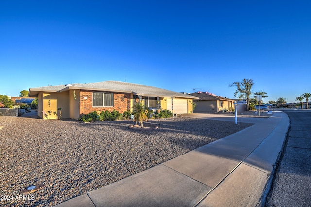 single story home featuring a garage