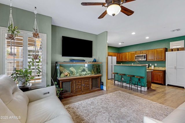 1316 S Minneola Ln, Gilbert, AZ 85296 - living room with ceiling fan, light wood-style floors, and recessed lighting
