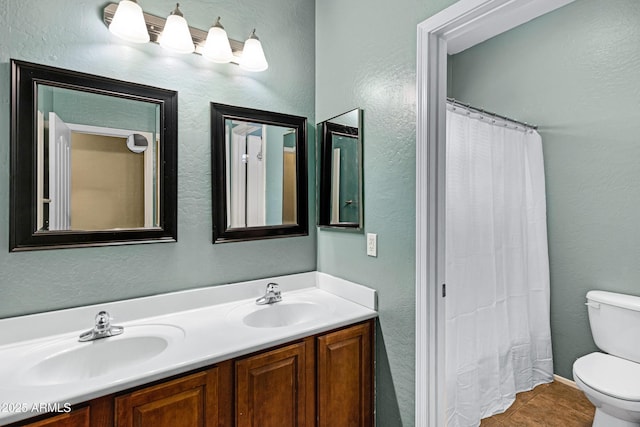 1316 S Minneola Ln, Gilbert, AZ 85296 - full bath featuring toilet, double vanity, tile patterned flooring, a textured wall, and a shower with curtain