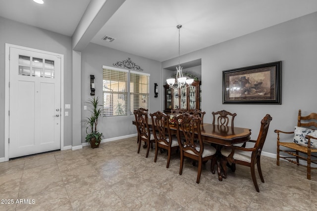 dining room with a chandelier