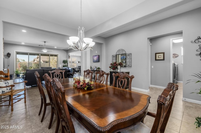 tiled dining area with ceiling fan with notable chandelier