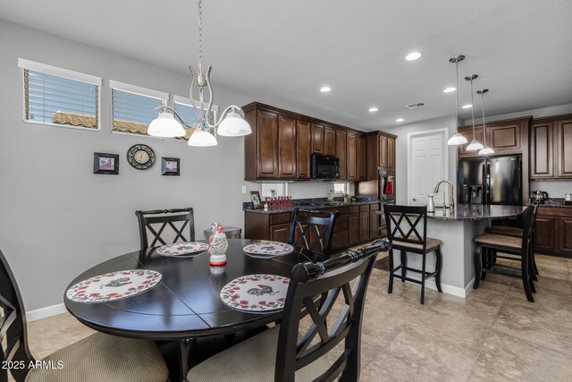 dining room featuring sink