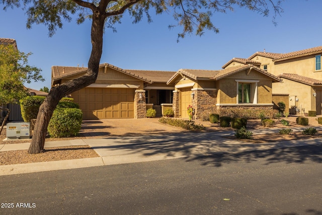 view of front of property featuring a garage and central air condition unit