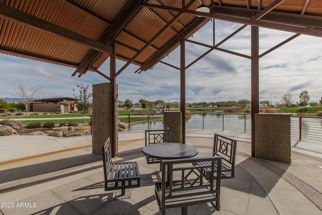 view of patio / terrace with a water view