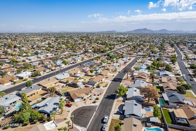 birds eye view of property featuring a mountain view