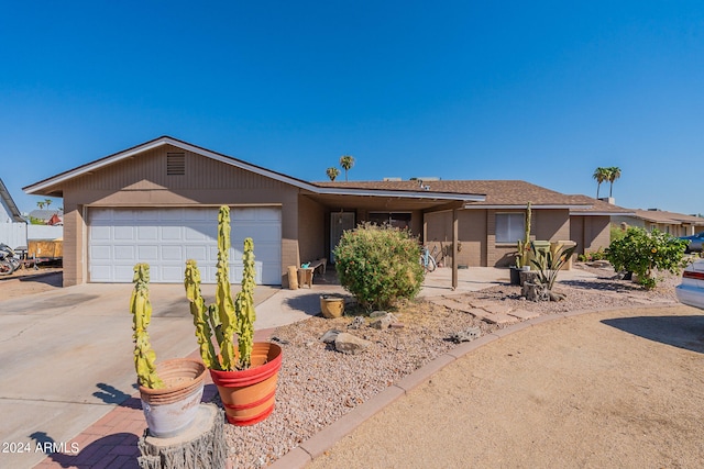 ranch-style home featuring a garage