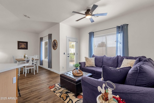 living room featuring hardwood / wood-style flooring and ceiling fan