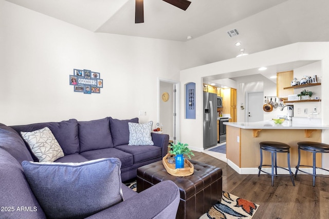 living room featuring dark hardwood / wood-style flooring, high vaulted ceiling, ceiling fan, and sink