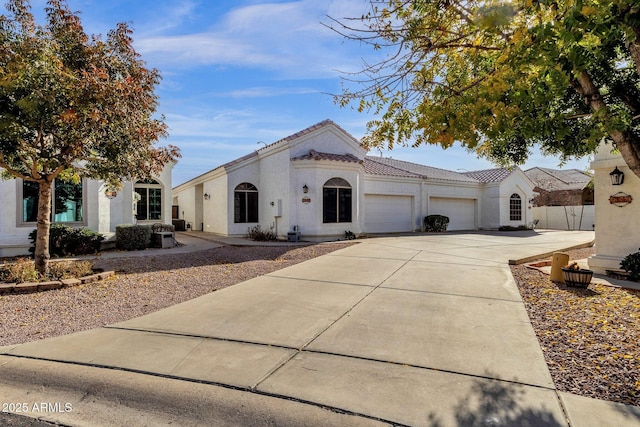 mediterranean / spanish-style house featuring a garage