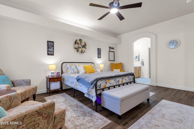 bedroom with dark hardwood / wood-style flooring, ensuite bathroom, and ceiling fan