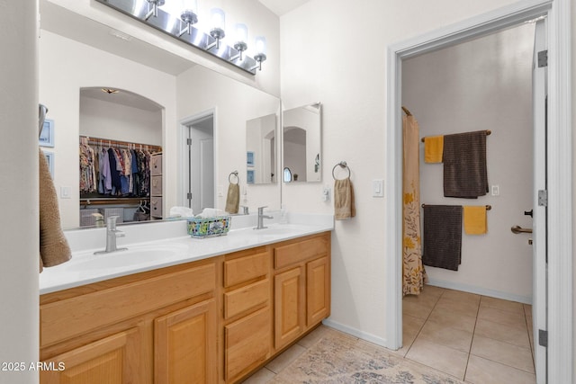 bathroom with tile patterned floors and vanity