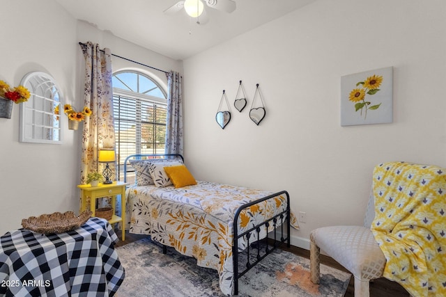 bedroom featuring hardwood / wood-style floors and ceiling fan