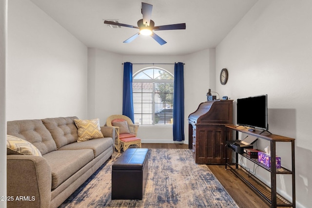 living room with ceiling fan and wood-type flooring