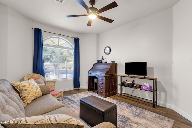 living room with hardwood / wood-style floors and ceiling fan