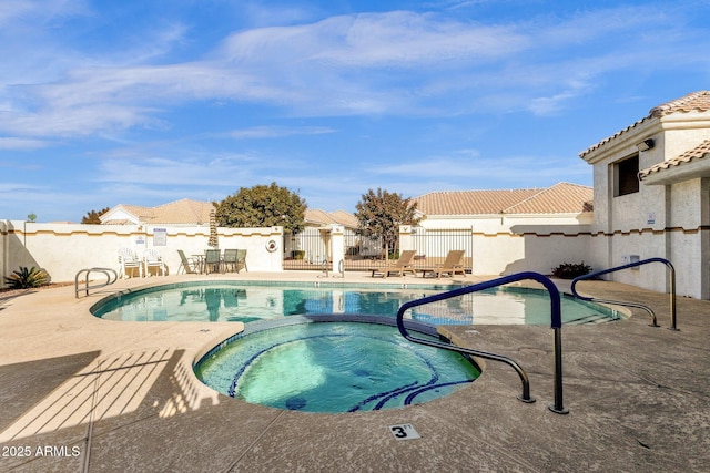 view of pool with a patio area and a community hot tub