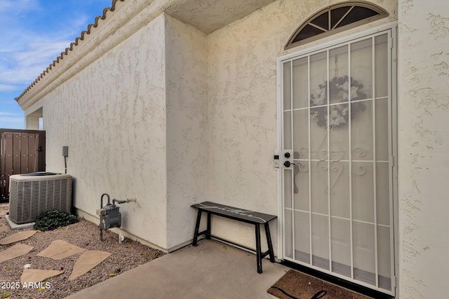 property entrance with central AC unit