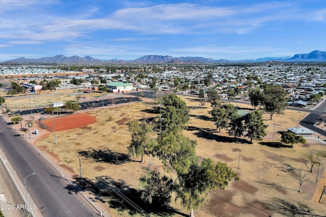 birds eye view of property with a mountain view