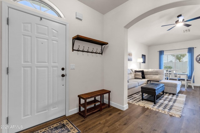 foyer entrance with dark hardwood / wood-style floors and ceiling fan