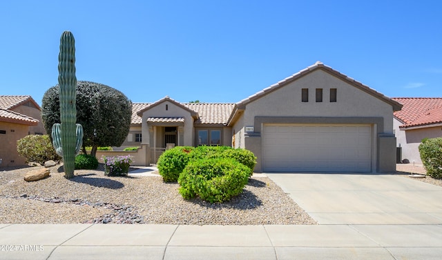 mediterranean / spanish-style house featuring a garage