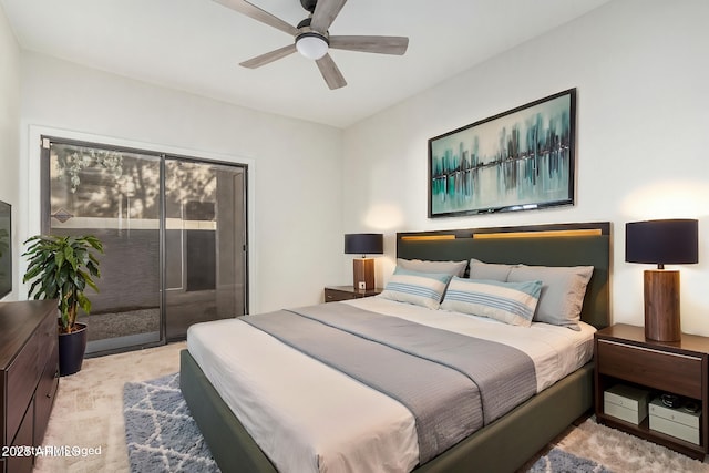 carpeted bedroom with access to outside and ceiling fan