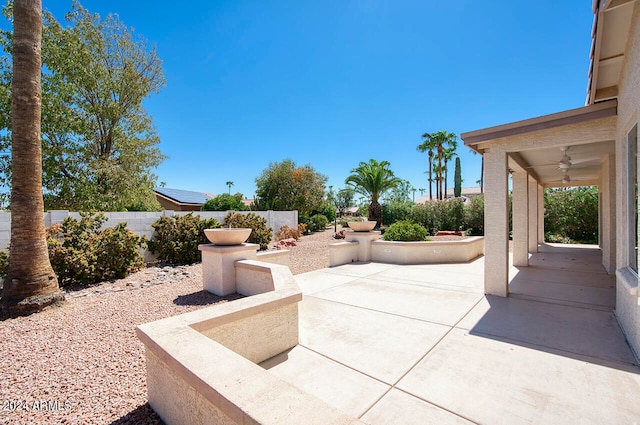 view of patio / terrace featuring ceiling fan