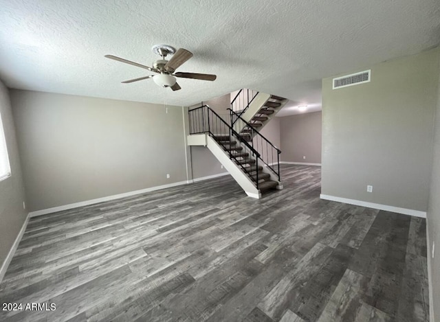 interior space with ceiling fan, wood-type flooring, and a textured ceiling