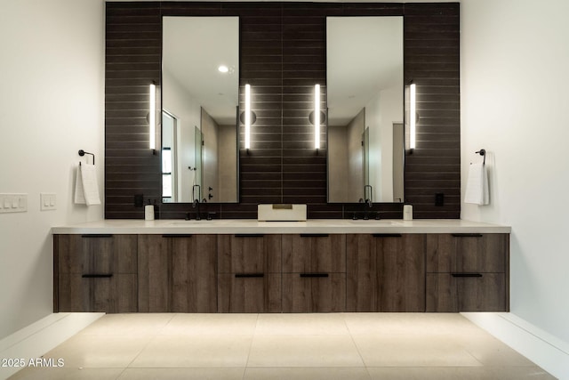 bathroom featuring double vanity and a sink