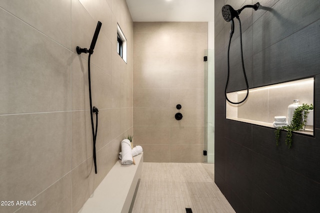 bathroom with a tile shower