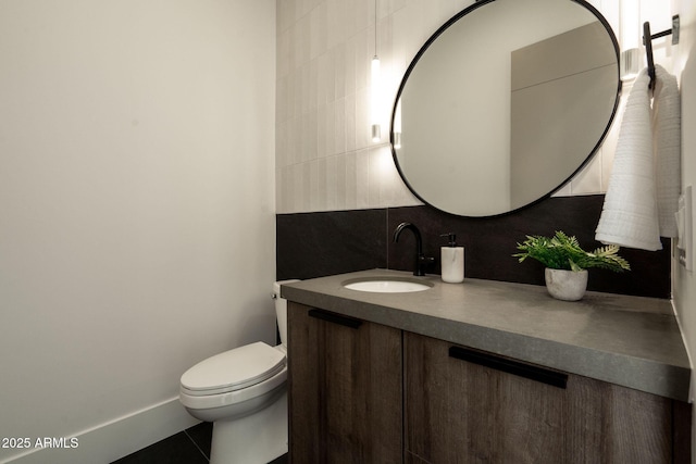 half bath featuring decorative backsplash, toilet, and vanity