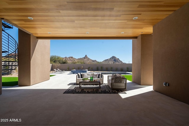 view of patio featuring a mountain view and an outdoor hangout area