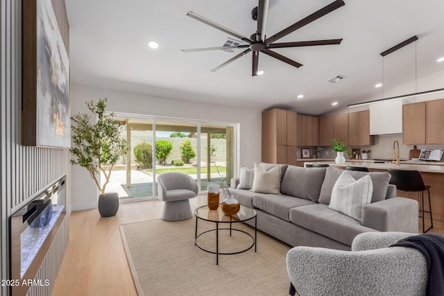 4532 E Sandra Ter, Phoenix, AZ 85032 - living room featuring light wood finished floors, recessed lighting, and ceiling fan