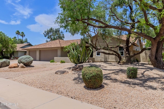 4532 E Sandra Ter, Phoenix, AZ 85032 - view of front of home featuring an attached garage, stucco siding, and concrete driveway